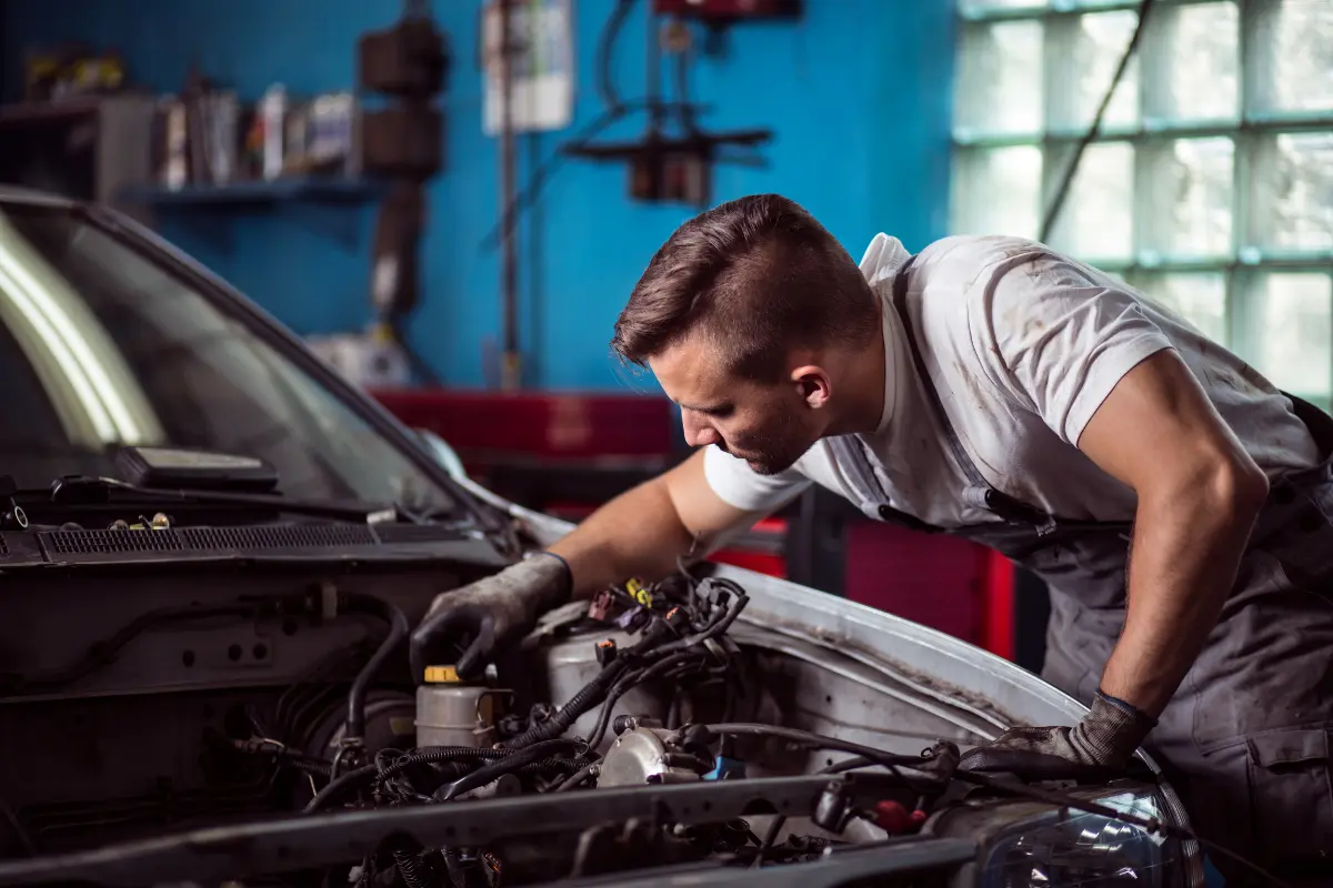 A Man Working On A Car